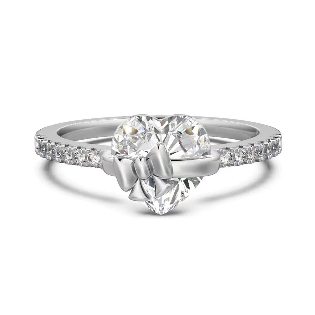 Silver Bow-Kissed Heart Ring with sparkling heart center and bow