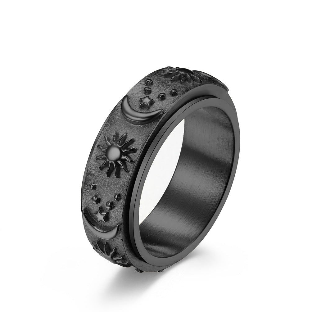 Black celestial spinner ring with sun moon and star details