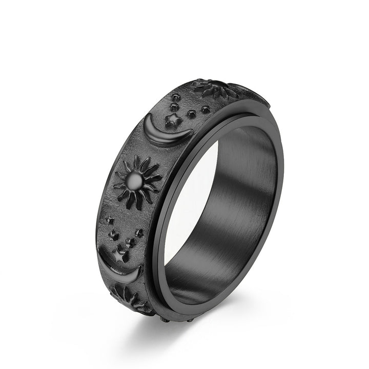 Black celestial spinner ring with sun moon and star details