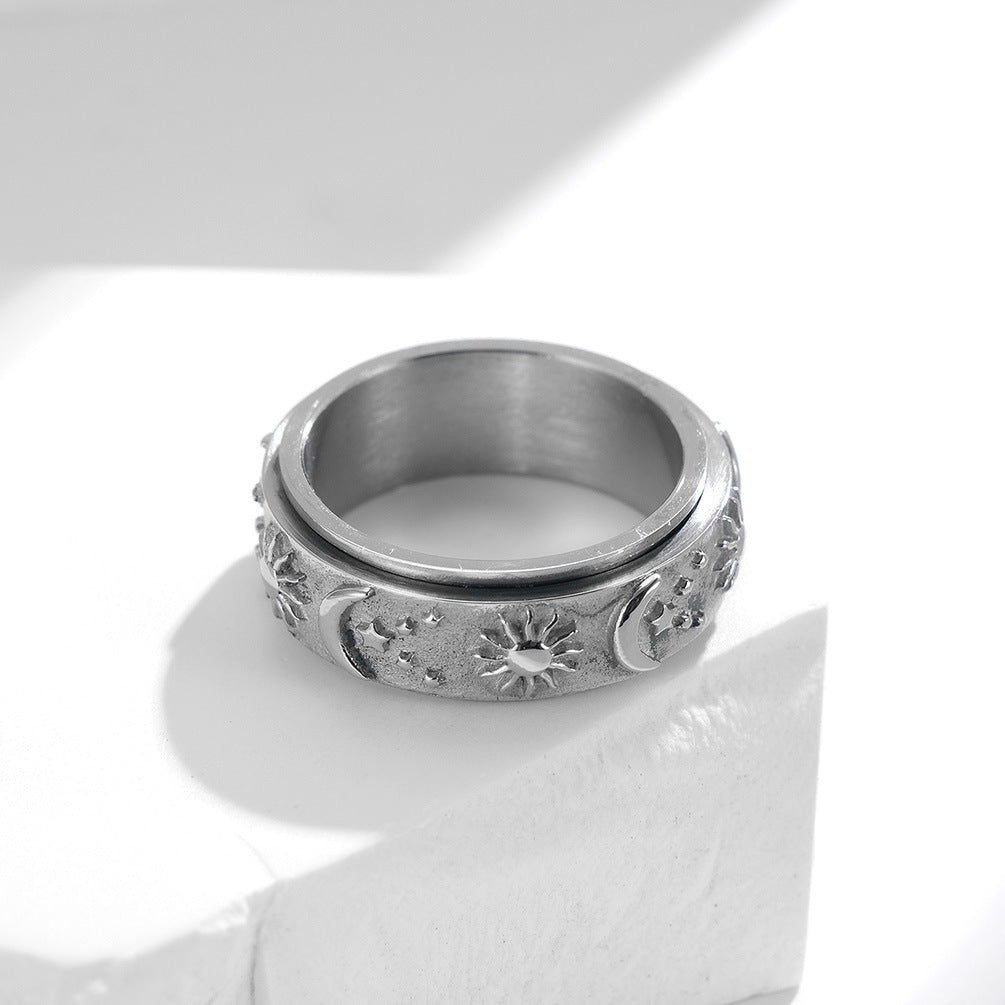 Silver celestial spinner ring showing the rotating center band