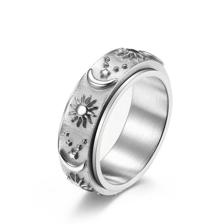 Silver celestial spinner ring with sun moon and star details
