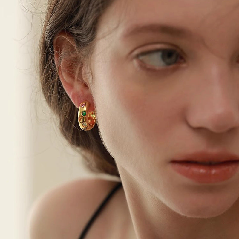 Model wearing gold Color Pop Huggie Hoop Earrings