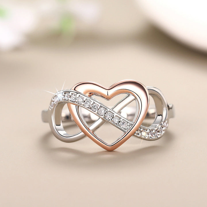 Close-up of rose-tone heart and sparkling intertwined curves