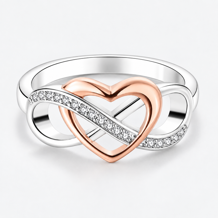 Two-tone intertwined heart ring with rose-tone heart and sparkling infinity curves