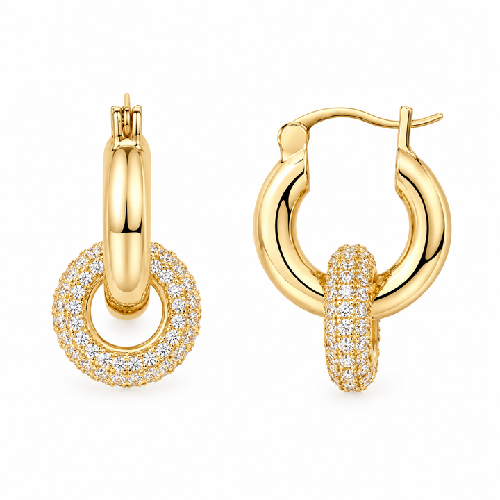 Gold hoop earrings with sparkling pave halo drops on white background