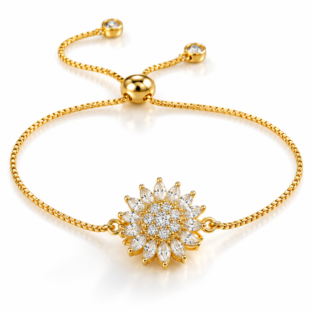 Gold-tone sunflower slider bracelet with sparkling floral centerpiece on a white background