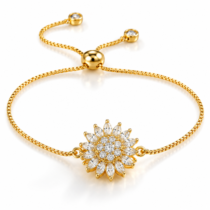 Gold-tone sunflower slider bracelet with sparkling floral centerpiece on a white background