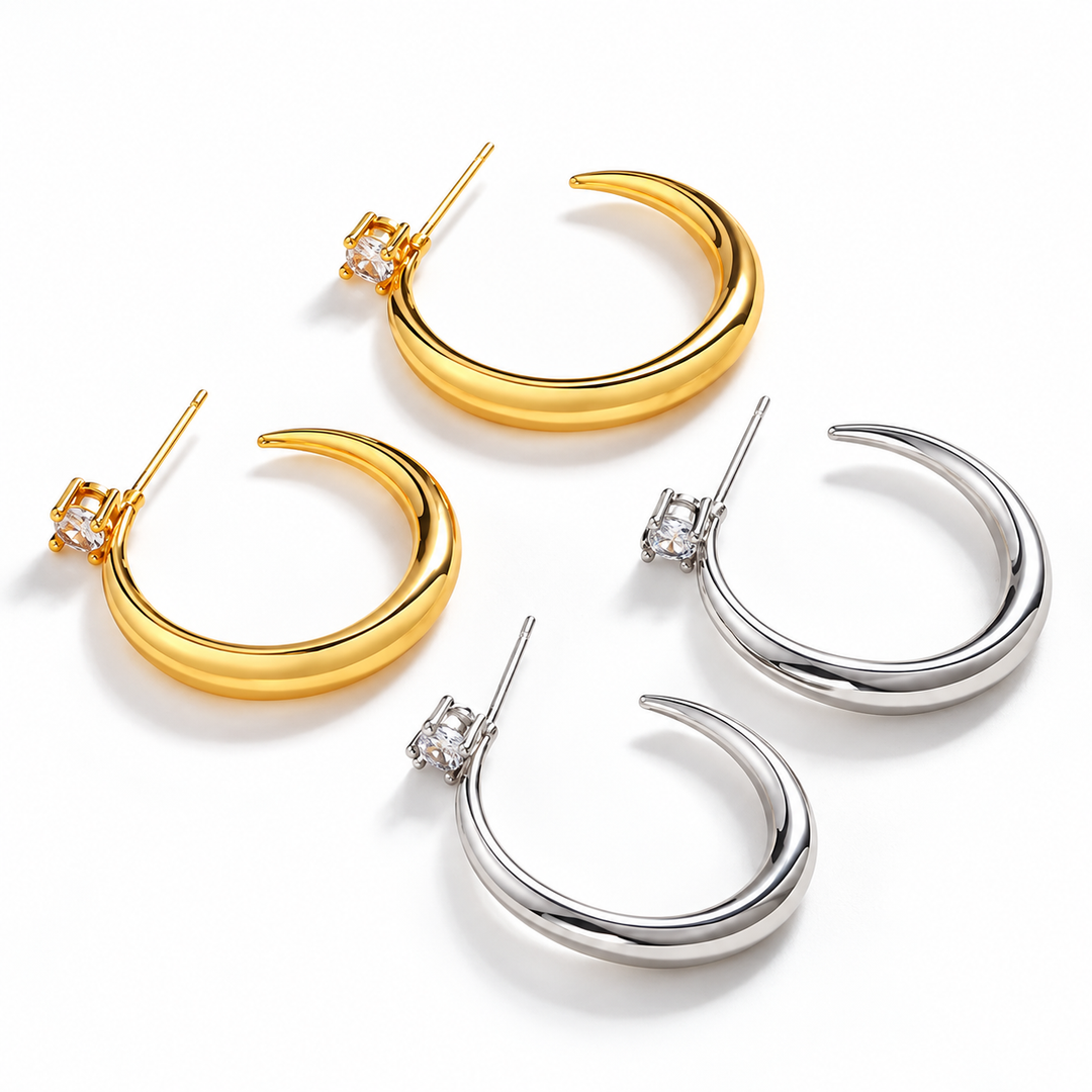 Gold and silver sculpted crescent hoop earrings
