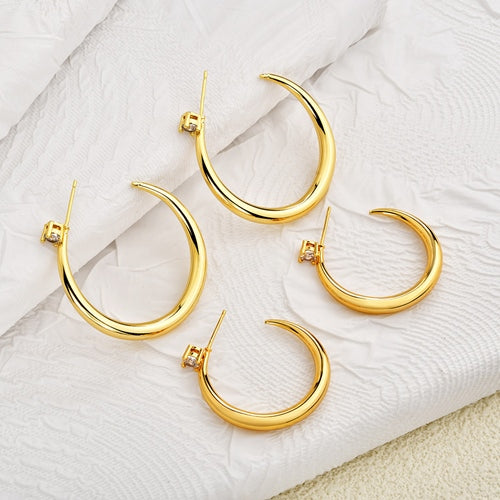 Gold crescent hoops in two sizes