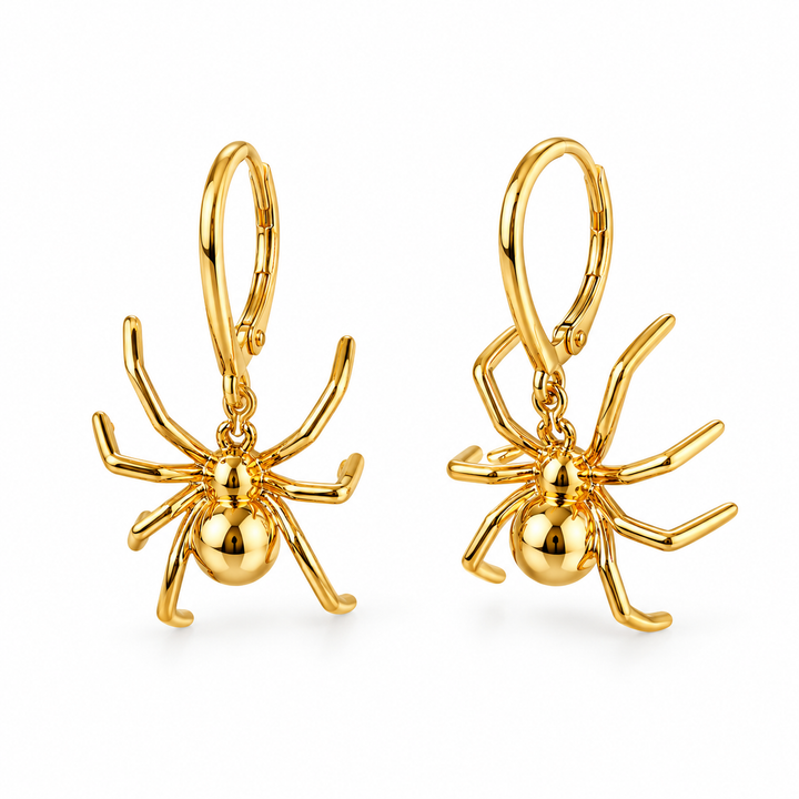 Gold spider-shaped drop earrings on white background